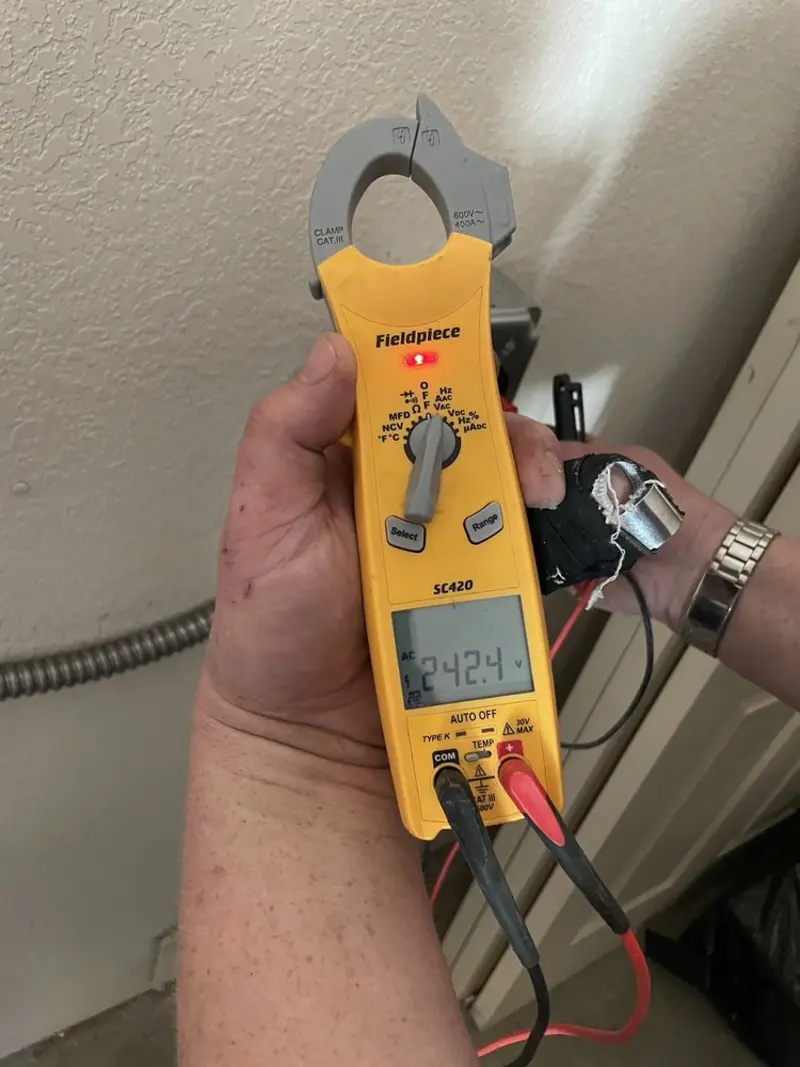 Voltage testing with clamp meter during Circuit Breaker Repair in Florence